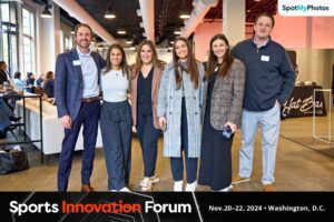 Event photography image of Connect team at sports innovation forum smiling